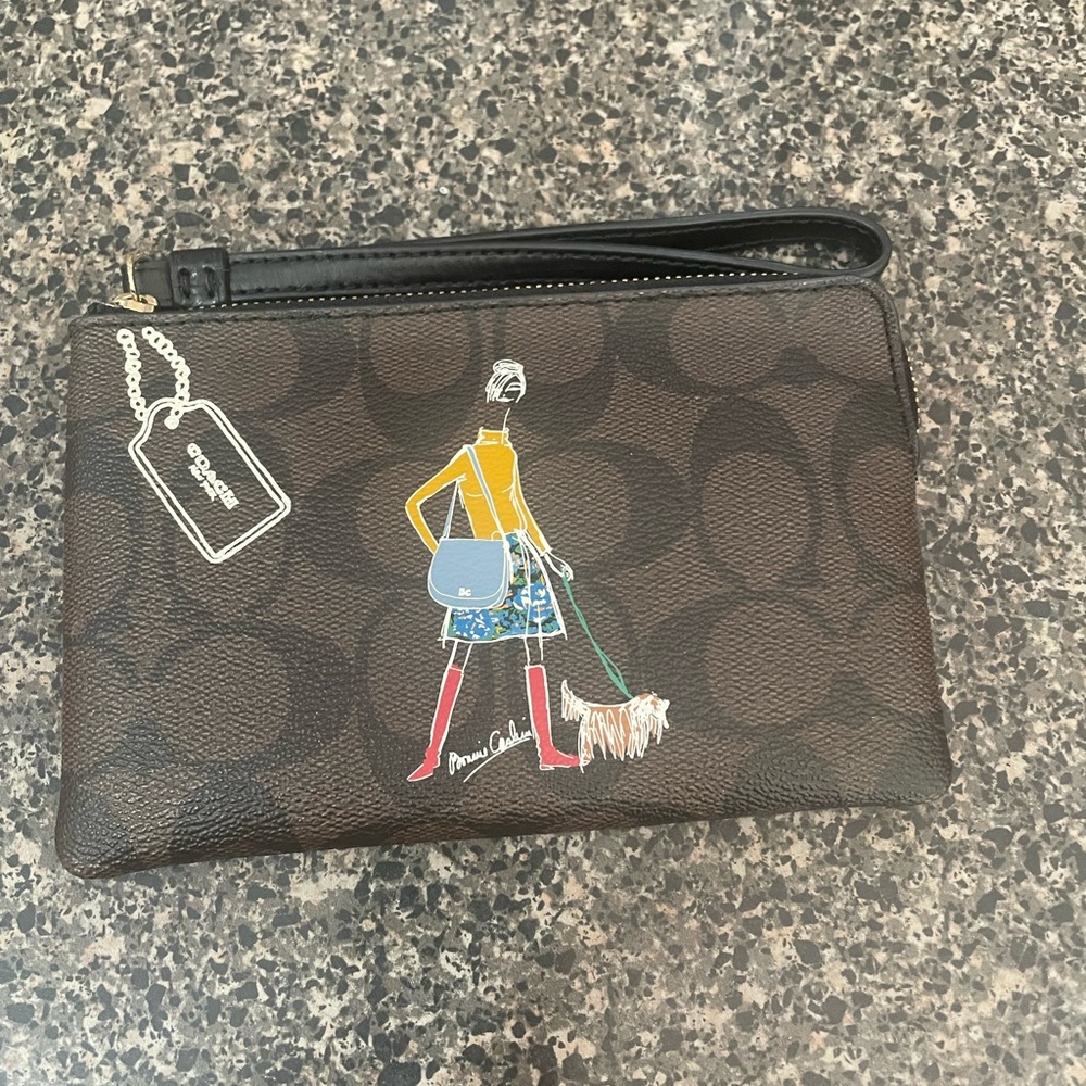 Coach X PC Brown logo “girl walking the dog “Wristlet .New without tags